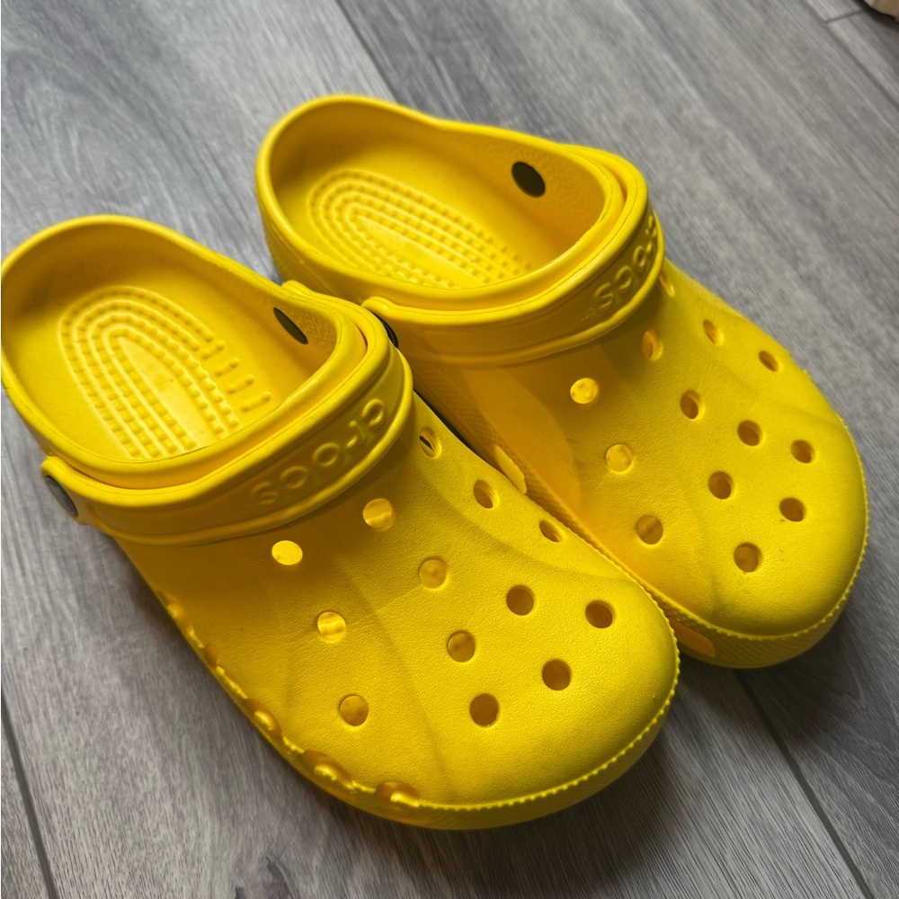 Yellow worn crocs